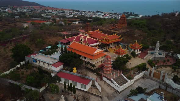 Aerial drone view of asian Buu Son precious buddhist temple at dusk. Vietnam attraction alt