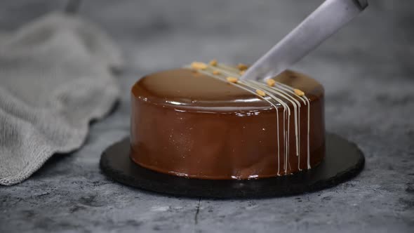 Cutting a Chocolate Caramel Peanut Mousse Cake and Mirror Glaze