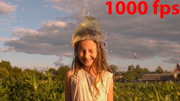 Water Balloon Splash On Little Girl's Head 4k alt