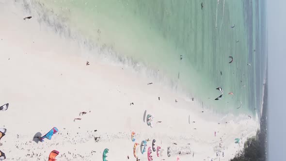 Zanzibar Tanzania  Vertical Video Kitesurfing Near the Shore of Ocean Slow Motion alt