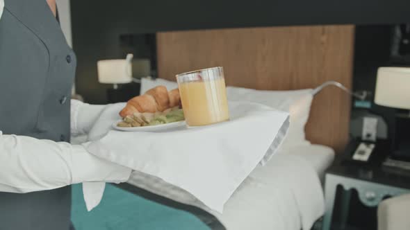 Waitress Bringing Breakfast in Hotel Room alt