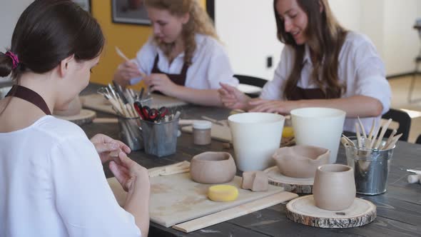 Beautiful Young Female Artist Girls Creating Handmade Pottery in Modern Art Studio. Education Kids alt