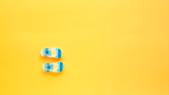 Blue Flipflops Walk on a Yellow Beach alt