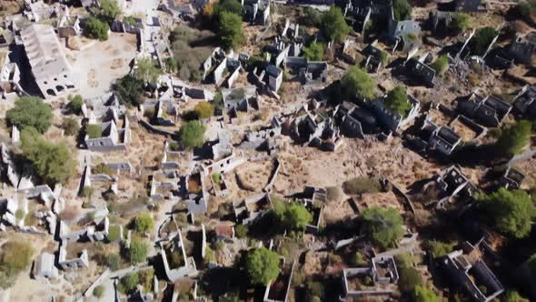 Top View of Ruined Ghost Town Kayakoy with Ancient Demolished Stone Buildings Without Roofs alt