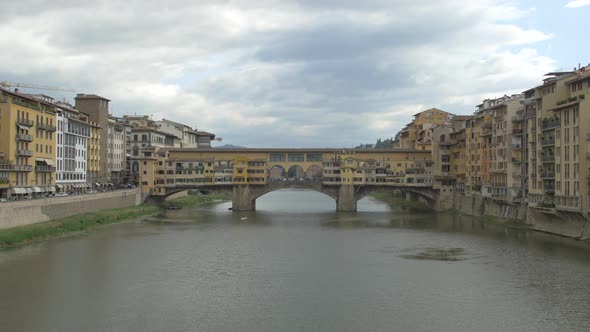 Tilt up of the Arno river in florence alt
