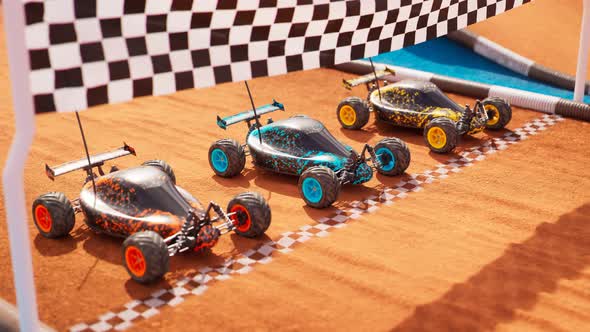 Three colourful RC-cars standing on a start line, ready for a toy race. 4KHD alt