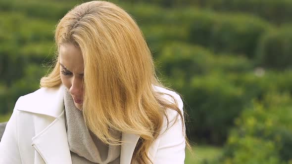 Young Mother-To-Be Suffering Headache, Having Doubts About Taking Painkiller alt