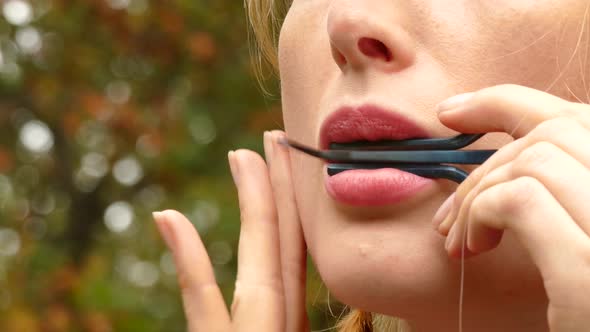 Portrait Of Blond Woman Playing Harp alt