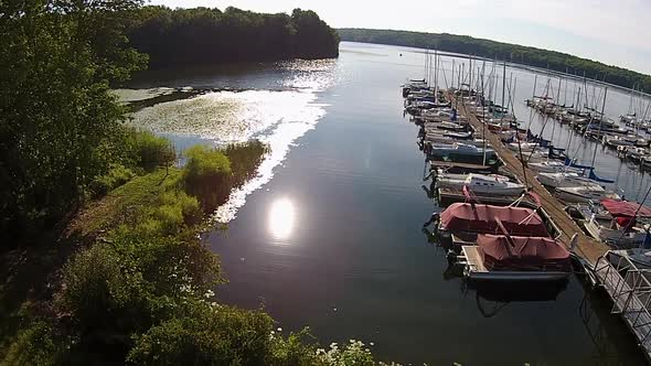 Aerial footage of sailboat marina. alt