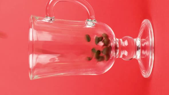 Vertical Video Coffee Beans Quickly Pour Latte Glass Cup Red Background