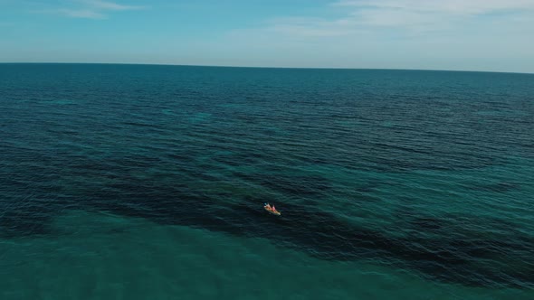Aerial Drone Shot of Friends Kayak in Ocean alt