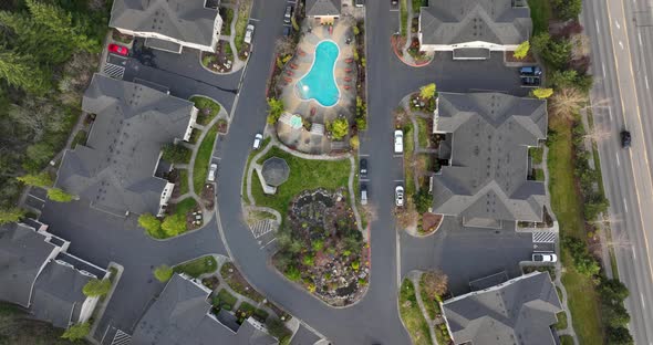 Town down aerial of a condominium complex in America. alt