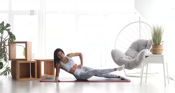 Black woman in sportswear doing workout burning fat calories. alt