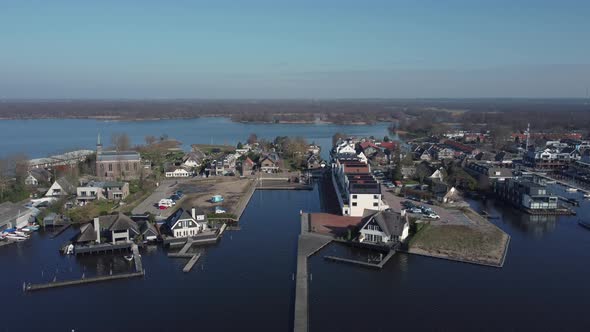 Loosdrecht dike in the Netherlands between the lakes, aerial downwards to pier alt