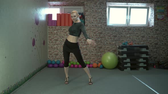 Girl in Heels Dancing in the Gym