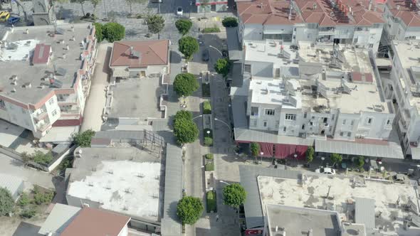 Drone Video of Urban Cityscape with Houses Roofs Streets and Roads alt