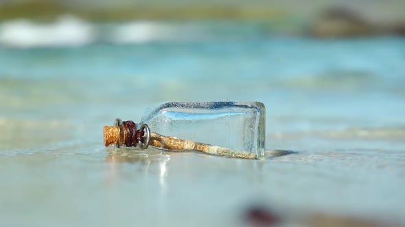 Message in the Bottle Against the Sun Setting Down alt