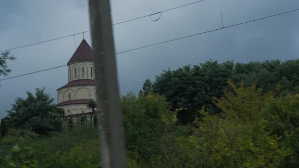 Driving by church in rural countryside