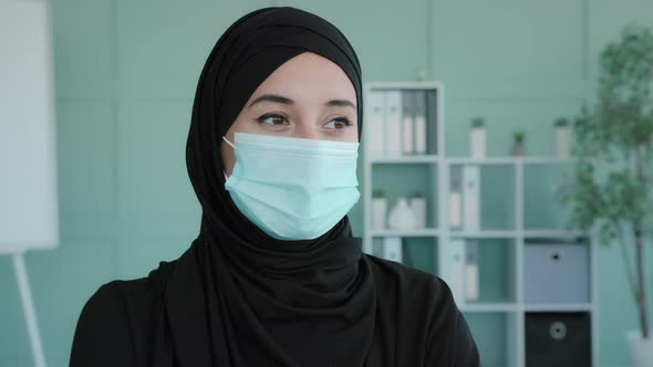 Portrait Arab Girl Islamic Muslim Woman Wearing Black Hijab Wearing Medical Mask in Office alt