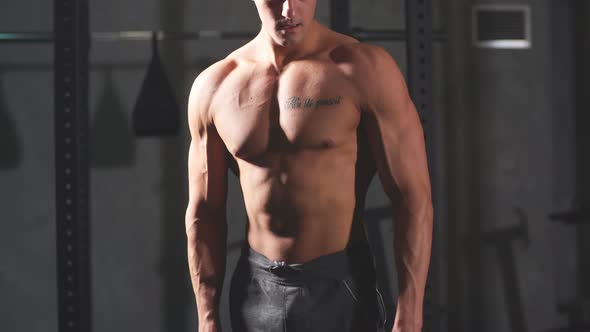 Male Athlete with Naked Torso, Highly Defined Muscles alt