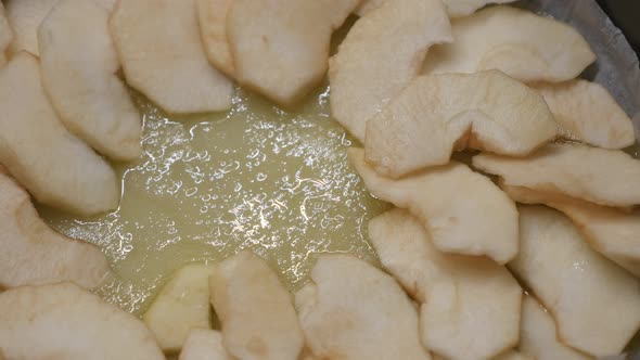 Close-up of apple pie detailed preparation  4K 2160p 30fps UltraHD footage - Fruit pieces in baking  alt