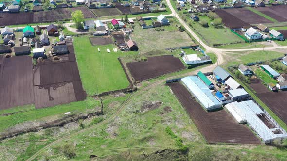 Aerial View of Russian Village with Small Farm Lands for Home Gardening