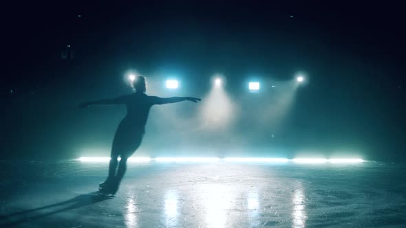 Young Girl is Skating Around the Ice Rink alt