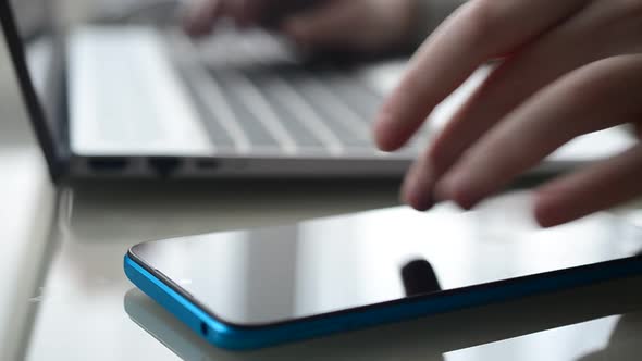 The girl working at home office hands on keyboard. alt