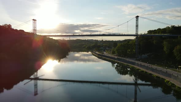 Aerial Shot The City Zhytomyr. Pedestrian Suspended Bridge Through The R. Teteriv. Ukraine alt