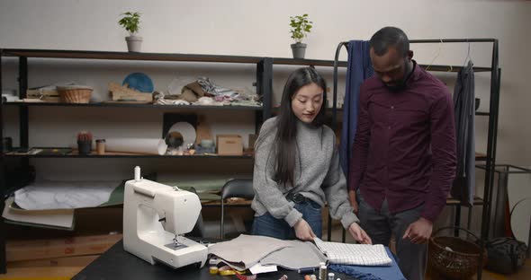 Diverse Designers Coworkers Talking in the Workshop alt