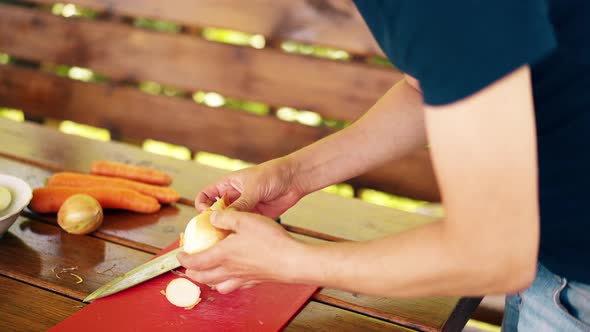 CU Travelling Shot Man is Standing in a Summer House Cooking Pilaf for Picnic alt