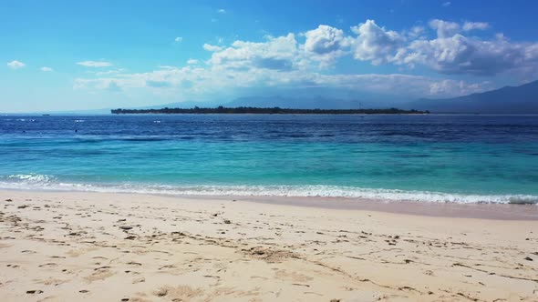 Aerial panorama of marine lagoon beach lifestyle by blue sea with white sandy background of a picnic alt
