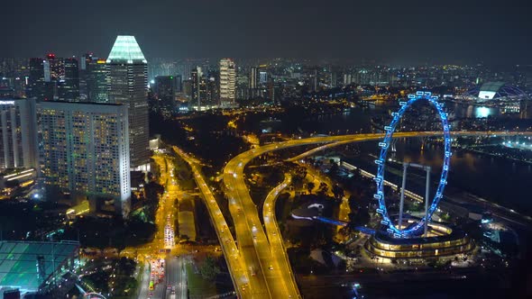 Cars driving on roads and highways in Singapore City at night in transportation concept