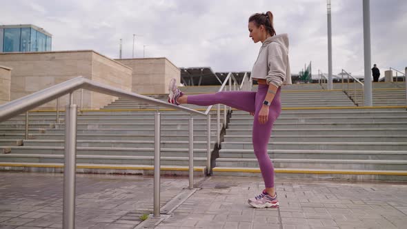 Healthy Lifestyle in City Woman is Training Outdoors for Good Looking alt