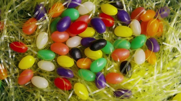 Rotating shot of Easter decorations and candy in colorful Easter grass - EASTER 009 alt