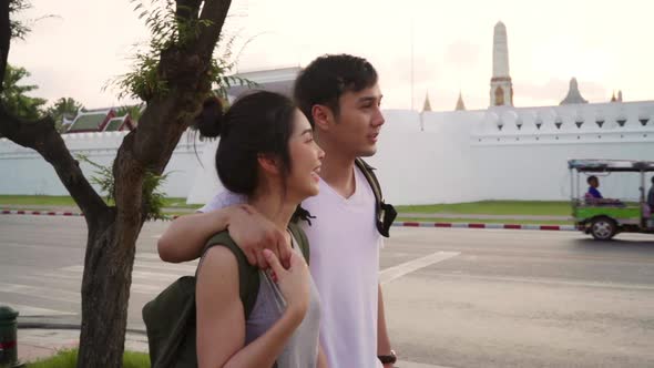Young couple feeling happy spending sweet time in holiday trip in sunset. alt