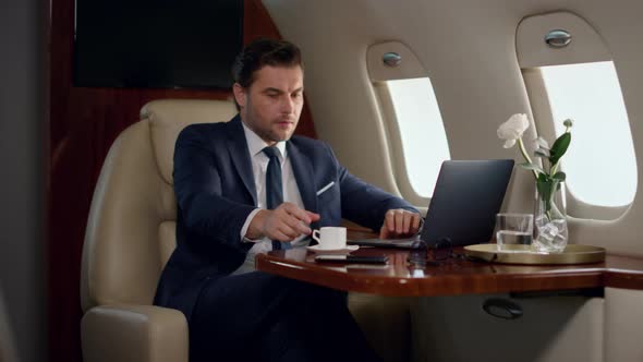 Stressed Professional Working Laptop in Airplane alt