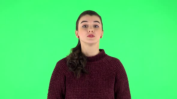 Beautiful Girl Is Reporting and Tells a Lot of Interesting Informations. Green Screen alt