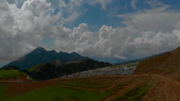 Aerial Video Shooting of a Deserted Hilly Area. a High Mountain Is Visible on the Horizon. the Sky alt