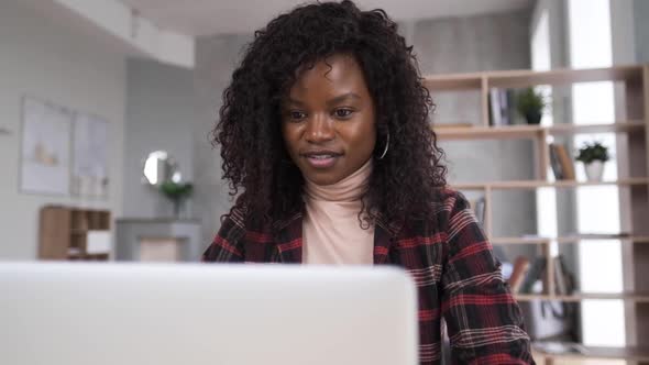 A Pretty Student Studying Online at Home, Using a Computer Video Calling Application To Watch a alt