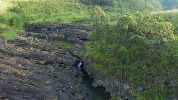 Aerial View of Tea Plantations, Fields, Waterfall During Sunrise. Sri Lanka Island