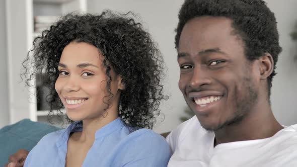 Smiling Young African Couple Looking in Camera alt