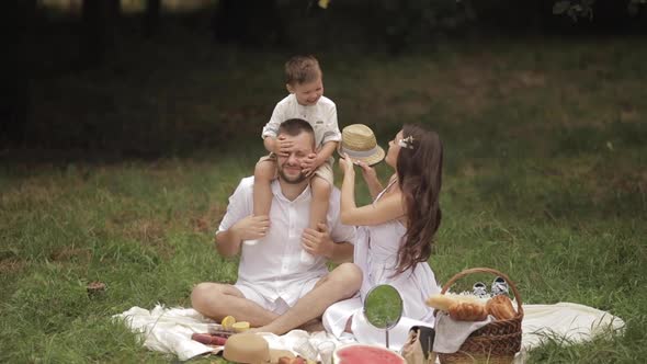 Woman Spending Leisure Time with Her Spouse and Child