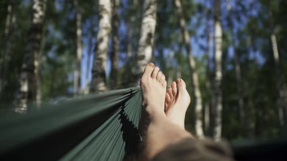 A Tired Guy Resting in the Open Air in the Wood alt