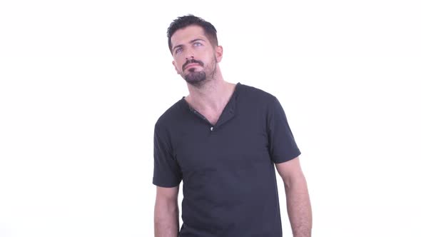 Stressed Young Bearded Man Looking Bored While Waiting alt