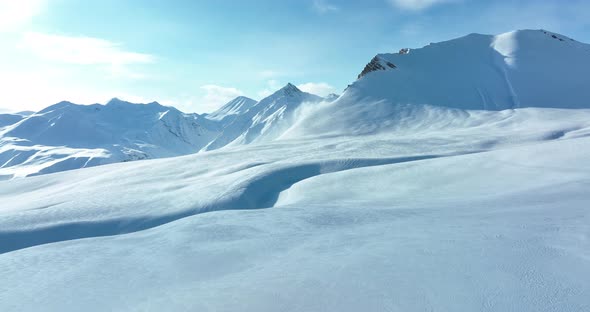 Aerial view of beautiful snowy mountains in Gudauri, Georgia alt