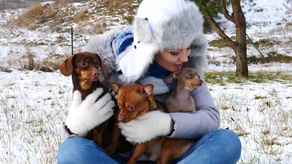 Woman with Dogs Outdoors in Winter