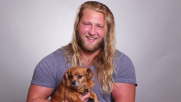 Portrait of man and dog on white background