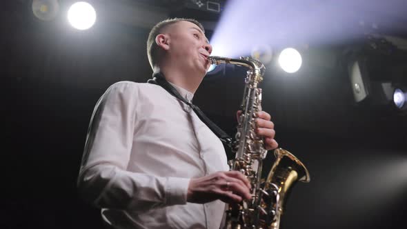 Cool Saxophonist Performing an Amazing Solo at Concert