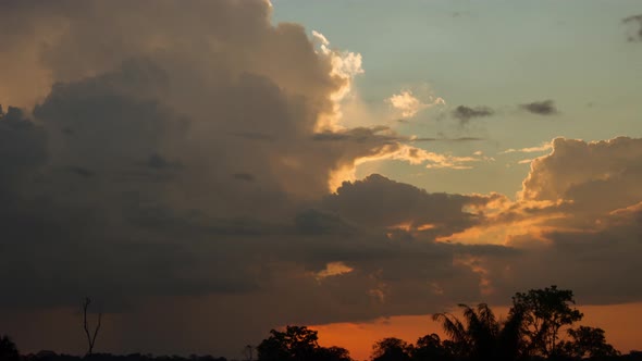 Time lapse - Sunset and rain clouds at the Amazon rain forest,